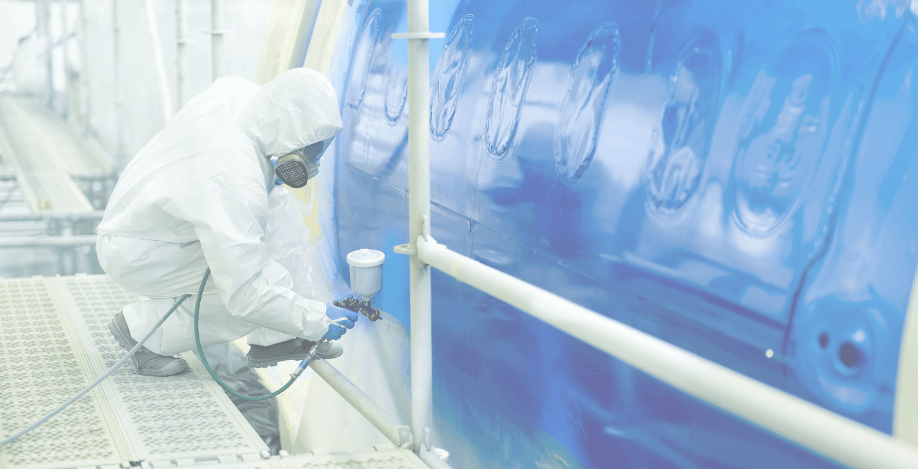 Worker applying marine coating